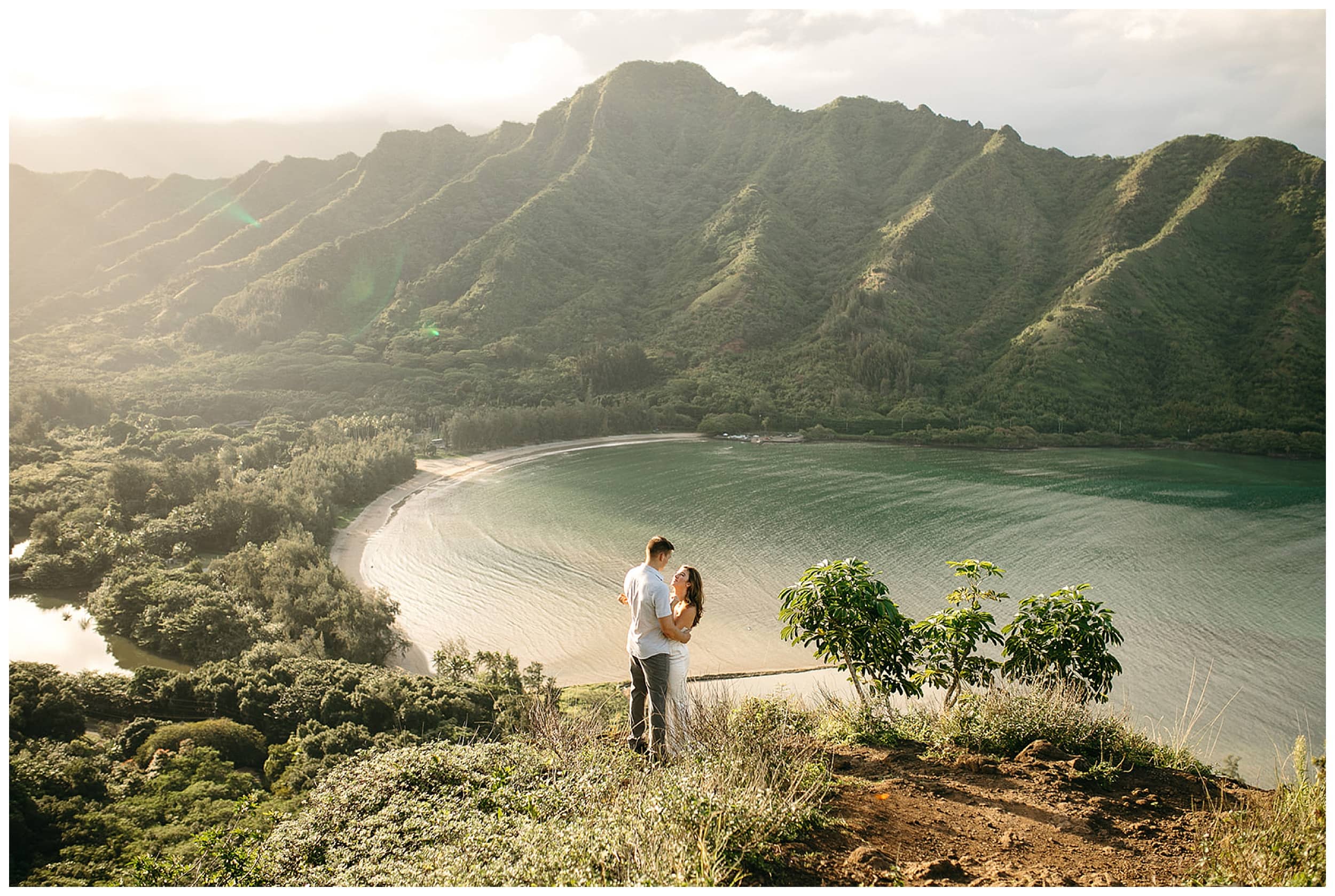 couple hugging in hawaiian mountains