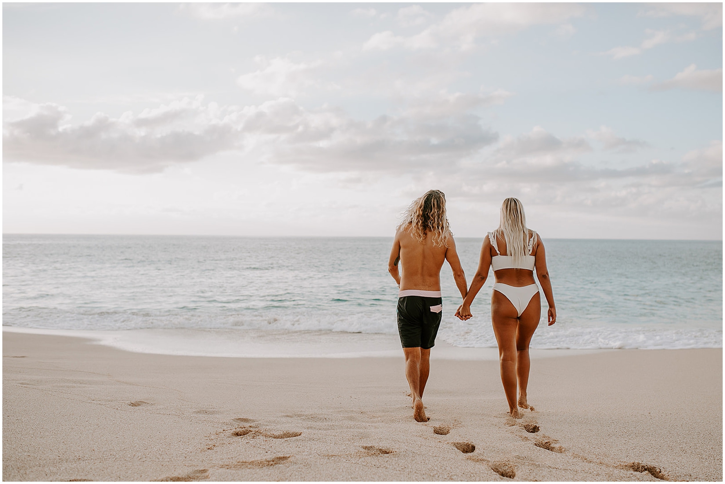 couple walking in sand