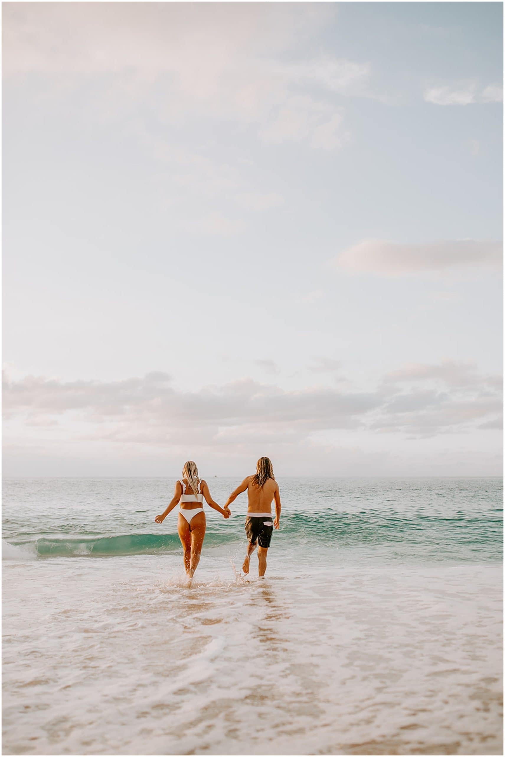 couple walking in ocean