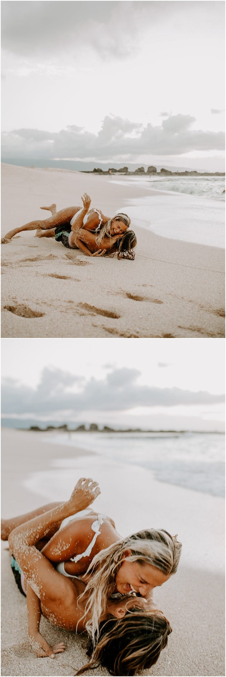 couple rolling in sand