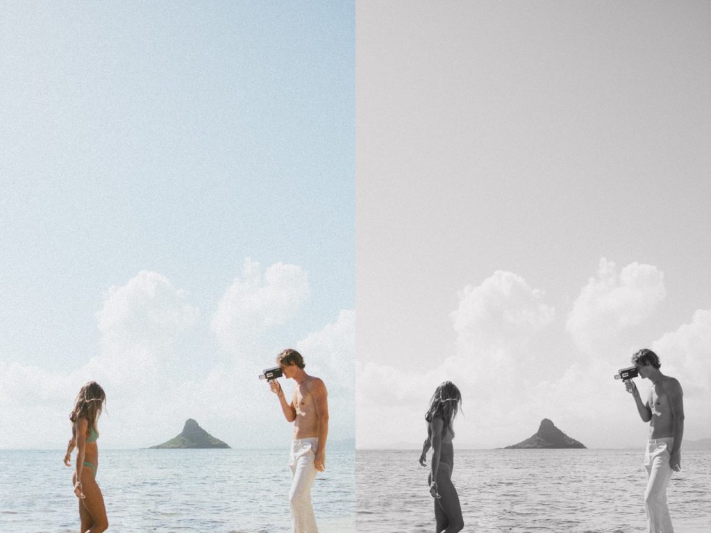 boyfriend is taking film picture of girlfriend at the beach