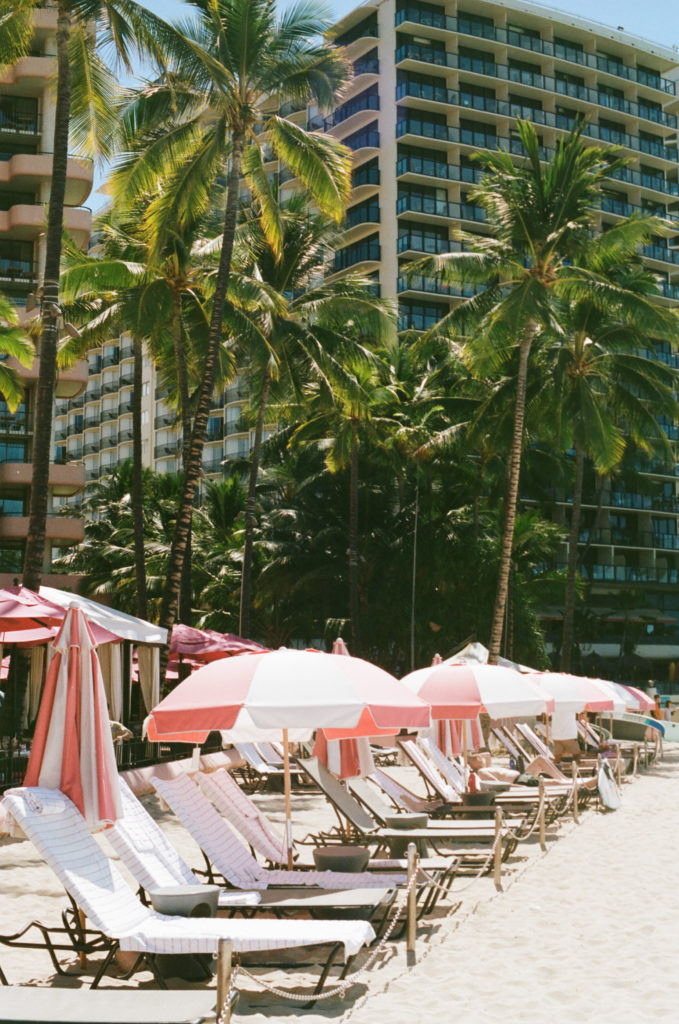 Film picture of beach seating at the Royal Hawaiian hotel