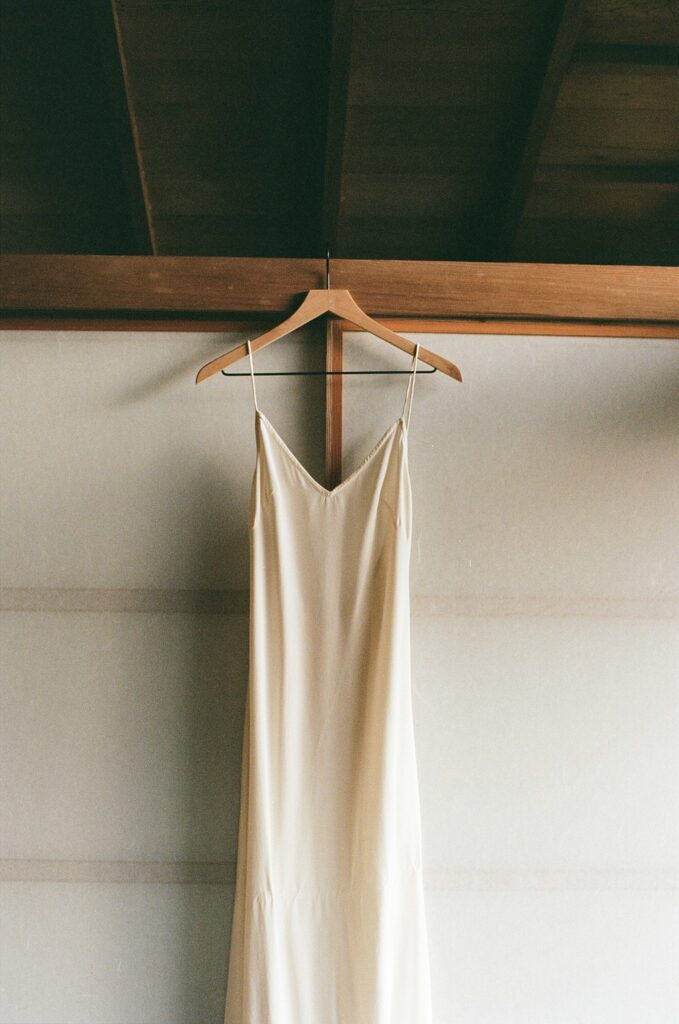 shot of wedding dress hanging on hanger