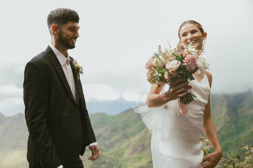 shot of bride and groom smiling at each other