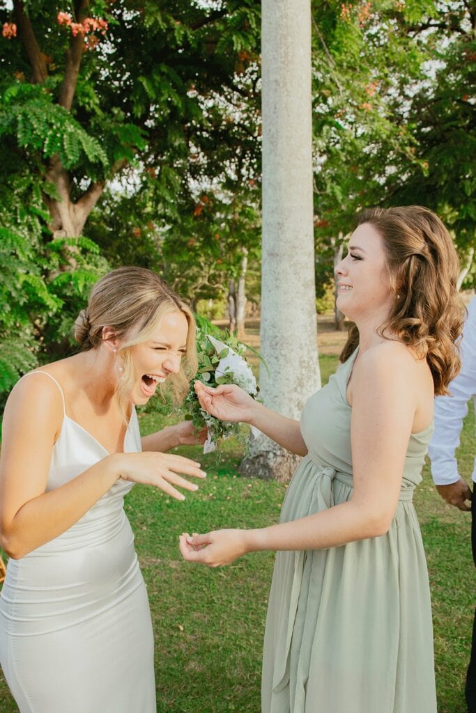 bride laughing with her sister