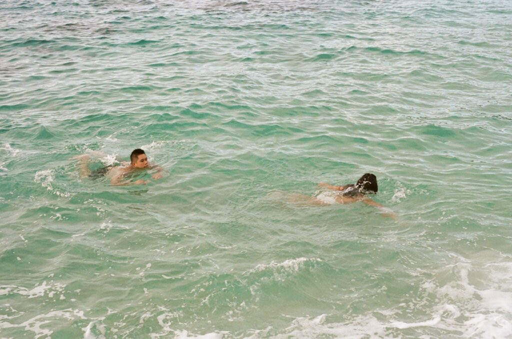 couple is swimming in the ocean