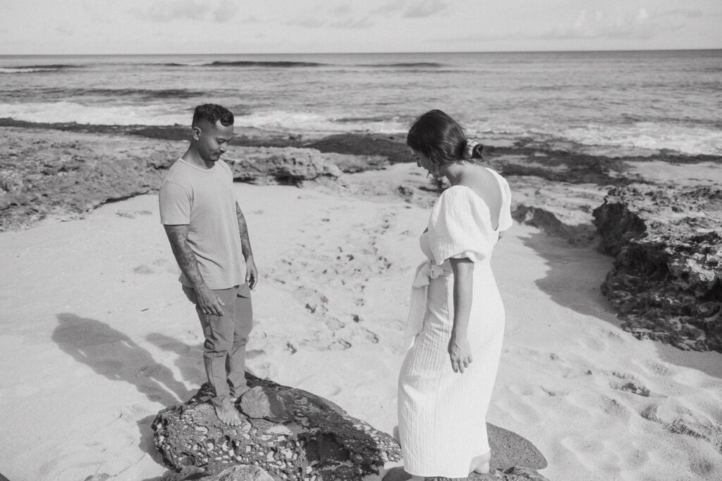 black and white photo of the couple on the beach